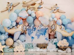 an airplane themed birthday party with balloons and decorations