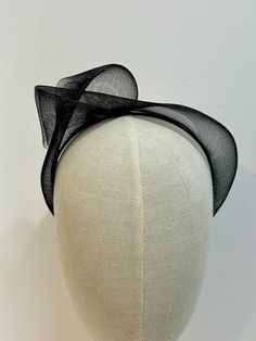 Stunning Black Crinoline Fascinator Headband. This Knotted Edgy Style Headband Fascinator has been make with Elegance in mind. Simple Design but makes a statement piece. Crinoline Fabric has been Hand knotted and Attached to a slim Satin Alice band. Very lightweight to wear. Hight is approximately 5cm Your Beautiful piece will arrive gift wrapped and packed well for shipping. Thank you for visiting my Shop If you would like a different Colour please contact me. Crinoline Fascinator, Crinoline Fabric, Headband Fascinator, Black Fascinator, Style Headband, Headband Wedding, Black Bandeau, Fascinator Headband, Alice Band