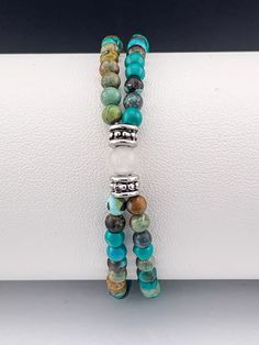 Elevate your style with our stunning double strand gemstone bracelets. Each bracelet features two strands of vibrant gemstones, meticulously selected for their beauty and energy. Perfect for adding a pop of color and elegance to any outfit, these bracelets are a must-have accessory for any jewelry collection. Authentic gemstone beads 4mm African Turquoise Turquoise Healing Bracelet With 108 Beads, Turquoise Wrap Bracelet With Gemstone Beads, Healing Turquoise Wrap Bracelet With Gemstone Beads, Adjustable Double Strand Spiritual Beaded Bracelets, Spiritual Double Strand Bracelets With Natural Stones, Turquoise Wrap Bracelet With Round Gemstone Beads, Spiritual Turquoise Bracelets With 108 Beads, Adjustable Double Strand Gemstone Beads Bracelet, Spiritual Turquoise Wrap Bracelet With Round Beads