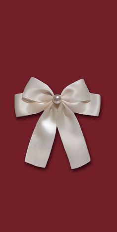 a white bow on a red background