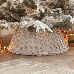 The 70cm Willow Christmas Tree Ring - White is a fantastic way to cover any plain or unsightly Christmas tree stand/base.This rustic, woven, wicker effect tree base sits easily underneath your treasured Christmas tree to complete your festive look and hide away any bases/stands that make your tree look less natural.Gather your Christmas presents around the skirt which will complement both the gifts and your tree as an everlasting part of your homely Christmas. Whether you've opted for a real or artificial tree, this natural base will complement the appearance and help artificial trees to look more realistic by hiding the metal or plastic stands. The stunning white colour of this base is perfect for pairing with flocked or snowy trees.The 70cm Christmas Tree skirt is perfect for trees that Willow Christmas Tree, Wicker Tree Skirt, Christmas Tree Ring, November Colors, Frosted Tree, Tree Base, Snowy Trees, Christmas Tree Stand, Artificial Trees