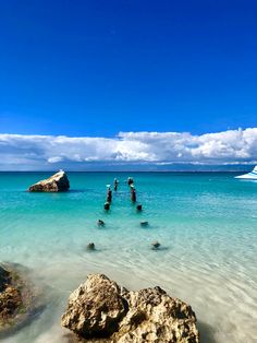 the water is crystal blue and clear with rocks in it