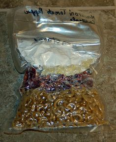 two bags of food sitting on top of a counter