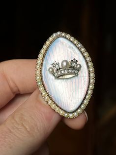 It is not every day that we have the pleasure of finding a rare heraldic jewel-- and I will admit I've been lazy to list this exceptional Victorian find for her rarity and outstanding symbolism. Featured here, a gorgeous third quarter of the 19th c brooch in 15ct gold decorated with opaline glass, a halo of wondrous pearls, and the heraldic British Naval Crown, rendered in diamonds, pearls, and gold. Seated on the purest opaline blue of a morning sky at sea, with radiating convex sun rays in the Crown Brooch, Morning Sky, Sun Rays, Gold Decor, Rarity, Halo, Diamonds, Crown, Sun