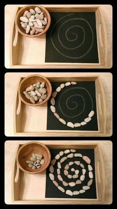 three wooden bowls filled with white rocks on top of a black mat next to each other