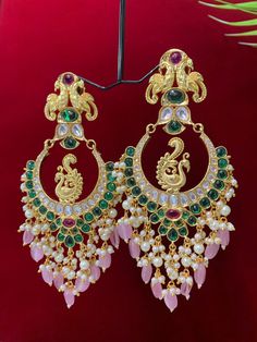 Premium quality High gold plated, pearl work, hand carved work , AD lining and kundan work. Clip back.  about 5.5 inch long  Absolute designer piece and statement earring. Luxury Kundan Danglers For Party, Luxury Traditional Kundan Chandelier Earrings, Luxury Jeweled Kundan Jhumkas, Luxury Festive Chandbali Earrings, Cheap Traditional Chandbali Jewelry, Luxury Chandbali Earrings For Ceremonial Occasions, Cheap Chandbali Bridal Earrings For Celebration, Luxury Kundan Chandelier Earrings For Diwali, Luxury Multicolor Earrings For Diwali