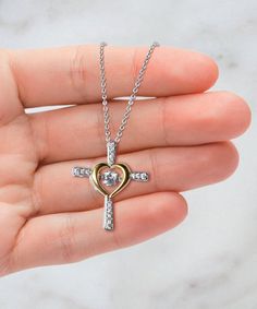 - Cross Dancing Necklace: Weight: 0.14 oz Stunning .925 Sterling Silver necklace.  AAAA grade cubic zirconia jewels set throughout the cross. Featuring a "dancing stone" centerpiece that is a large AAAA grade cubic zirconia stone. The gold heart is triple plated in 14K gold. The pendant is 1 inch (25mm) in length and 0.85 inch (21.6mm) in width.  The wishbone necklace chain length is shorter, a total of 17.5 inches including the extender, and the other necklaces chain length is 19.5 inches. Our Christmas Dancing, Dancing Pendant, Card Jewelry, Wishbone Necklace, Message Necklace, Wife Necklace, Dance Necklace, Bonus Mom, Cross Heart