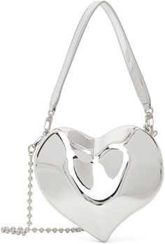 Sculptural resin bag in silver-tone. · Detachable patent faux-leather carry handle · Detachable ball-chain shoulder strap · Hinged magnetic closure · Grained faux-leather lining · Logo-engraved silver-tone hardware · H7 x W8 x D4 Supplier color: Silver Silver Glossy Finish Bags, Silver Heart-shaped Bag For Formal Occasions, Formal Silver Heart-shaped Bag, Chrome Purse, Resin Bag, Silver Shoulder Bag, Strap Hinges, Silver Bag, Silver Bags