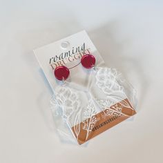 These gorgeous floral earrings add an elegant and unique look to any outfit. Design is laser cut out of 1/8 inch acrylic. Posts are made of surgical steel. Earrings are approximately 2.5 inches long. Each product is handmade and may vary slightly from the picture. Only one pair of earrings are included in this listing. Props are not included. White Laser Cut Earrings As A Gift, White Laser Cut Earrings For Gift, White Laser-cut Jewelry For Gifts, Arch Trellis, Orange Boxes, Surgical Steel Earrings, Outfit Design, Rainbow Earrings, Steel Earrings