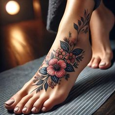 a woman's foot with flowers and leaves on it