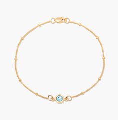 With a minimalist splash of color, our dainty Jules Birthstone Bracelet is an easy way to glam up any trendy outfit. This gold bracelet features a bezel cut birthstone available in twelve colors. Available in sterling silver or 24k gold vermeil Bezel pendant size: 1/4" Custom 4 millimeter crystal 6 1/2" satellite chain Lobster claw closure Made in the USA SHIPPING NOTE ﻿- This custom item takes 10 business days to produce from the order date SKU: BYB1146 Elegant Gold Chain Bracelet With Birthstone, Everyday Fine Jewelry Birthstone Bracelets, Diamond Bracelet With Gemstone Accents As A Gift, Adjustable Yellow Gold Chain Bracelet With Birthstone, Adjustable Yellow Gold Birthstone Chain Bracelet, Yellow Gold Jewelry With Birthstone Round Beads, Sterling Silver Yellow Gold Bracelets With Birthstone, Yellow Gold Sterling Silver Bracelets With Birthstone, Elegant Beaded Birthstone Bracelets