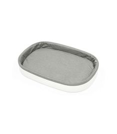 a grey and white dog bed on a white background, with the bottom section partially closed