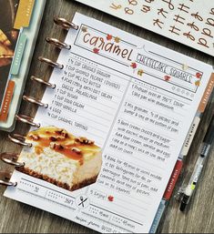 a recipe book with an image of a piece of cheesecake on it next to other items