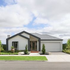 a white house with black trim and windows