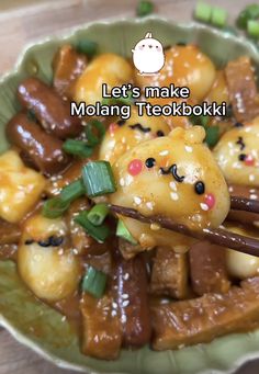 a bowl filled with food and chopsticks on top of a wooden table in front of the words let's make molang teokokuki