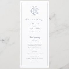 a white and blue wedding program card on a marble surface with the words, welcome to the