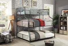 a metal bunk bed sitting next to a brick wall