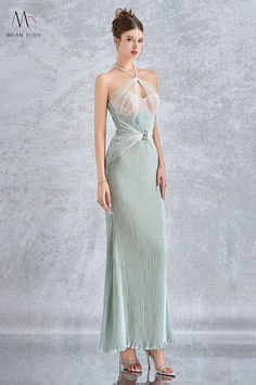 Made with exquisite silk lace and designed with a halter neckline and seductive cut-outs, this ankle length dress exudes elegance and sensuality. Perfect for any formal occasion, this dress will turn heads and make you feel confident and sophisticated. Elegant Backless Gown With Sheer Bodice, Elegant Evening Dress With Lace Bodice And Backless Design, Elegant Backless Evening Dress With Lace Bodice, Formal Backless Evening Dress With Lace Bodice, Elegant Backless Maxi Dress With Lace Bodice, Elegant Backless Lace Gown, Elegant Halter Neck Gown For Prom Season, Halter Neck Evening Dress With Sweep Train For Gala, Backless Evening Dress With Lace Bodice