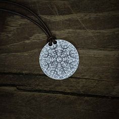 "The Warrior's Stave is known by many names: The Helm of Awe... The Warrior's Helm... and even the Helm of Terror. In Icelandic, it is referred to as Ægishjálmur or Aegishjalmur. -1.25\" diameter -solid .999 fine silver pendant -30\" leather cord There is ancient history to this stave, wherein the Fáfnismál, one of the poems in the Poetic Edda, the havoc-wreaking dragon Fafnir attributes much of his apparent invincibility to his use of the Helm of Awe: \"The Helm of Awe, I wore before the sons o Handmade Viking Style Jewelry For Outdoor, Viking Style Handmade Festival Jewelry, Poetic Edda, The Helm Of Awe, Helm Of Awe, The Son Of Man, Nice Leather, Ancient History, Leather Necklace