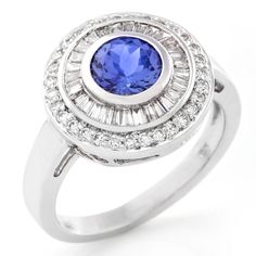 a blue and white diamond ring on a white background with the center stone surrounded by smaller diamonds