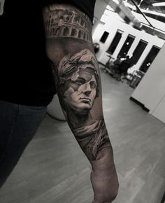 a man's arm with a statue of liberty and the words america on it