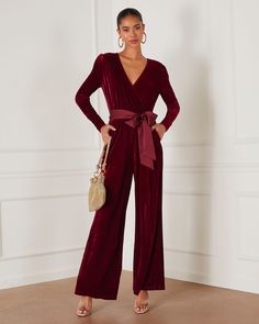 Fancy meets festive in the Love One Another Velvet Pocketed Cutout Back Jumpsuit. It features a satin waist tie that can be formed into a bow and a draped, V-neckline that's classy yet inviting. This trendy, versatile look is complete with a comfy, elastic waistband and barely-there side pockets. Draped V-neckline with snap button Elastic waistband Pocketed Satin waist tie Velvet fabrication Back center opening Neckline button closure Self & Contrast: 95% Polyester 5% Spandex Velvet Sleeve, Loose Jumpsuit, Love One Another, Bow Belt, Velvet Bow, Daily Dress, Sequin Top, 2024 Collection, Black Jumpsuit