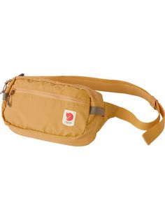 a tan fanny bag with a red apple on the front and side pocket, attached to a brown belt