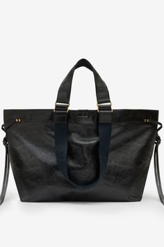 CABAS EN CUIR WARDY ISABEL MARANT Luxury Black Tote Duffle Bag, Black Luxury Soft Leather Duffle Bag, Luxury Black Soft Leather Duffle Bag, Isabel Marant Wardy Bag, Black Weekender Bag With Leather Handles For On-the-go, Rings Metal