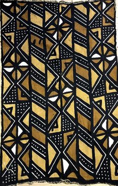 an old black and gold cloth with geometric designs