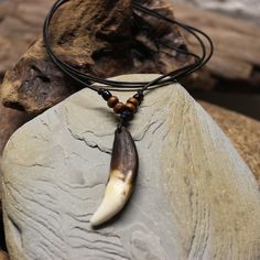 Large Rustic Wolf Tooth Necklace Wolf Teeth Necklace Wolf Necklace Wolf Tooth Necklace Adjustable African Native American Large Wolf Tooth Necklace Simple rustic large wolf tooth necklace made by me with wood & glass beads on a adjustable leather cord I purchase these teeth through a trader that goes around buying them and other things from Tibetan farmers that protect their livestock from the wolves Very nice and simple handmade wolf tooth adjustable necklace on a leather cord. Please view all Teeth Necklace, Large Wolf, Wolf Tooth Necklace, Largest Wolf, Necklace Tattoo, Wolf Tooth, Wolf Teeth, Wolf Necklace, Tooth Necklace