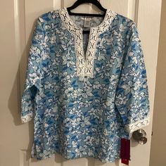 Cathy Daniels Tunic Floral Blouse Size Size L Made In India Colors Blue And White 60 % Rayon 35% Polyester 5% Spandex Exclusive Of Decoration Lace Around The Collar And Cuff. This Items Has No Stains Or Tears. It Is In Excellent Condition. Smoke And Pet Free Home Please See The Pictures For Measurements Bundle With Other Items From My Closet To Get A Good Deal. Items Will Be Shipped On Same Day Depending On Time Of The Purchase Or The Next Day Blue Tops With 3/4 Sleeves For Vacation, Blue Split Neck Blouse, Blue Cotton Half Sleeve Blouse, Blue 3/4 Sleeve Tops For Daywear, Blue Half Sleeve Cotton Blouse, Blue Tunic Blouse For Daywear, Black Tunic Tops, Grey Leopard Print, India Colors