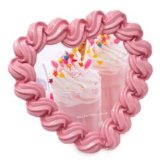 a pink heart shaped frame with two drinks in it