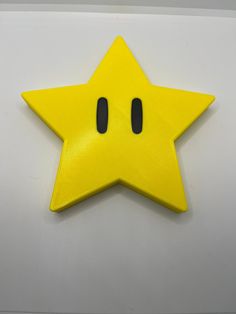 a yellow star with two black eyes on it