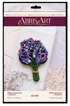 the brooch is made with beads and has a flower on it's side