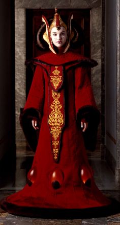 an image of a woman dressed in red and wearing a costume that looks like a demon