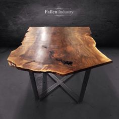 a wooden table with metal legs and a large piece of wood on it's side