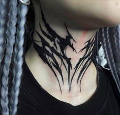 a woman with braids on her neck wearing a black shirt