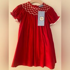 Nwt Red Everyday Heirloom Toddler Dress. It Is Marked As 12 Months, But Runs A Bit Larger. It Is Corduroy With A Smocked Neck And Ruffle Sleeves. Perfect For The Holiday Season! Red Cotton Dress With Smocked Back, Fitted Red Cotton Smocked Dress, Red Fitted Cotton Smocked Dress, Red Smocked Dress With Ruffles And Short Sleeves, Red Cotton Smocked Dress, Red Cotton Smocked Dress With Smocked Bodice, Red Cotton Smock Dress, Red Smock Cotton Dress, Red Cotton Dress With Smocked Bodice