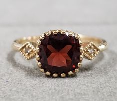 1. Red Garnet 14k Gold Ring 2. Ships quickly 3. Gemstone - Garnet, Diamond  4. Jewelry Type - Gold Ring 5. Total Weight - 3.020 Gram Approx. 6. Garnet Weight - 2.25 Carats 7. Diamond Weight - 0.02 Carats  8. Gold Weight - 2.566 Grams Approx. 9. Garnet Size - 7 x 7 MM 10. Gold Purity - 14k 11. Band Size - 2 MM 12. Handmade Items 13. AAA Quality Ring 14. Stackable Ring 15. Shape - Cushion  16. Ready to Dispatch in 1 - 2 days.  Pictures are taken under natural and day light. Dainty Gold Ring, Gold Ring For Women, Dainty Gold Rings, Jewelry Dainty, Solid Gold Jewelry, 14k Gold Ring, Ruby Ring, Red Garnet, Ring For Women