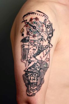 a man's arm with a tattoo on it that has an image of a clock