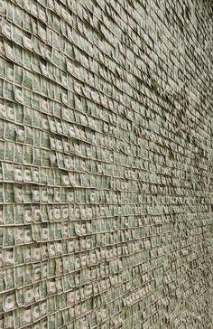 a wall made out of hundreds of dollar bills