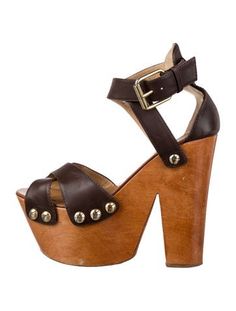 Giuseppe Zanotti Leather SandalsBrownStudded AccentsPlatformCrossover Straps & Buckle Closure at SidesFit: This style typically runs a half size small. Unfortunately, due to restrictions, this item may not be eligible for shipping in all areas. Brown Ankle Strap Heels With Strap Detail, Chic Brown Heels With Straps, Brown Open Heel Strappy Shoes, Brown Strap Heels With Open Heel, Brown Open Heel Strap Heels, Brown Heels With Strap And Open Heel, Formal Brown Strap Sandals, Brown Heels With Strap And Round Toe, Giuseppe Zanotti