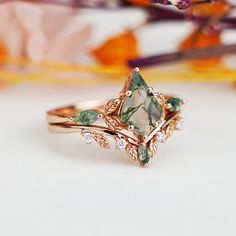 a close up of a ring with flowers in the background