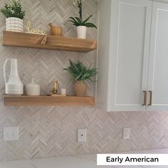 two wooden shelves with plants on them in a white tiled kitchen countertop and backsplash