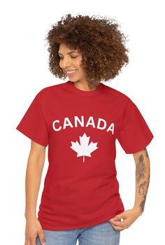 a woman wearing a red shirt with the words canada on it