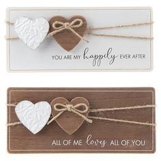 two wooden tags with hearts tied to them