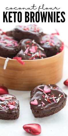 chocolate keto brownies with pink sprinkles in a wooden bowl on a white surface