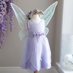 This Little Girl's Fairy Set Is Every Little Girl's Dream! The Dress Can Be Worn By Itself For A Special Occasion Or Add The Wings And Halo And She's Off To Fairy Land! Two Looks For The Price Of One! The Beautiful Lavender Little Girl's Dress Has Lovely Details. Embroidered Lace/Organza Trim At Waist With Lavender Satin And Organza Ribbons Hanging From Lavender And Green Rosettes. Organza Petal Shaped Layers On Skirt Have Satin/Organza Rosettes As Well. Zipper Back With Organza Sash. Lavender P Blush Pink Long Dress, Coral Long Dress, Lilac Flower Girl Dresses, Navy Blue Chiffon Dress, Lavender Fairy, Fairy Princess Costume, Wings And Halo, Pink Bow Dress, Blue Chiffon Dresses