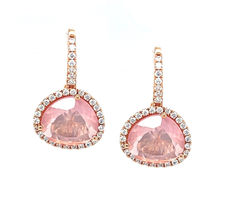 These pretty drop earrings feature faceted rose quartz crystals set in 18k rose gold with sparkling diamond set frames! The rose quartz are a unique "onion" shape with beautifully delicate pink color that is perfectly complemented by the rose gold. The halos framing these lovely gems are set with brilliant white diamonds that sparkle with every movement of the wearer! A great finishing touch for both daytime and evening attire, these earrings are a perfect blend of elegance and fun!! Pink Diamond Teardrop Earrings, Pink Teardrop Diamond Earrings, Rose Gold Earrings With Gemstone Accents, Pink Drop Earrings With Diamond Accents, Pink Rose Cut Diamond Earrings For Gift, Luxury Pink Gemstone Earrings, Formal Pink Earrings With Gemstone Accents, Rose Quartz Earrings, Sparkling Diamond