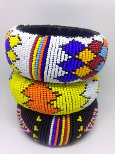 Multi coloured beaded bangle Multicolor Bangle With Colorful Beads, Multicolor Beaded Bangle, Multicolor Round Beads Bangle For Festival, Festival Colorful Beads Stretch Bangle, Bohemian Bangle With Colorful Beads, Festival Stretch Bracelet With Colorful Beads, Traditional Multicolor Bangle With Round Beads, Multicolor Beaded Bangle For Festival, White Beaded Bangle With Round Beads